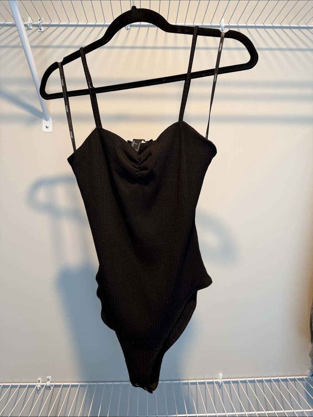 Black Ribbed V‑Neck Bodysuit